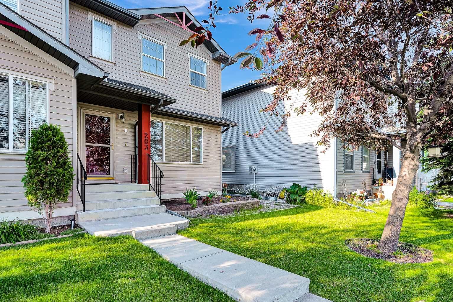 Property Photo: 203 Covemeadow Crescent AB T3K 6B1