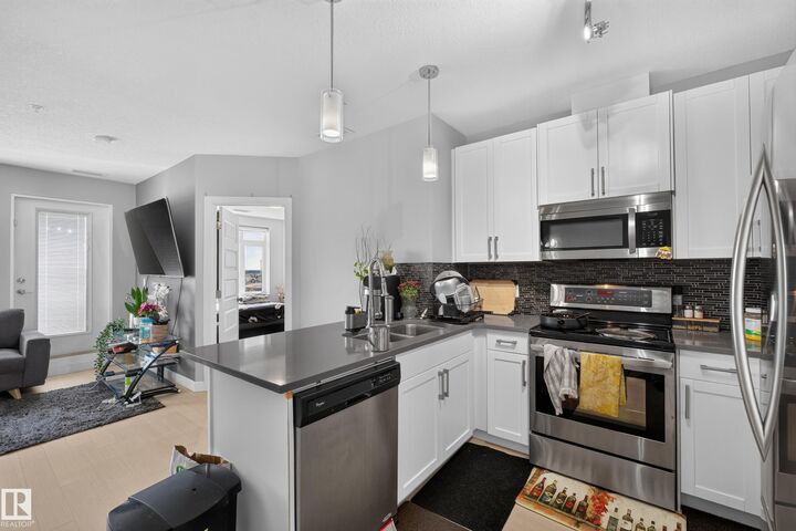 Property Photo: 5151 Windermere Boulevard SW 706 AB T6W 2K4