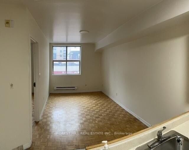 Property Photo: 126 Dundas Street 202 ON M5B 1E2