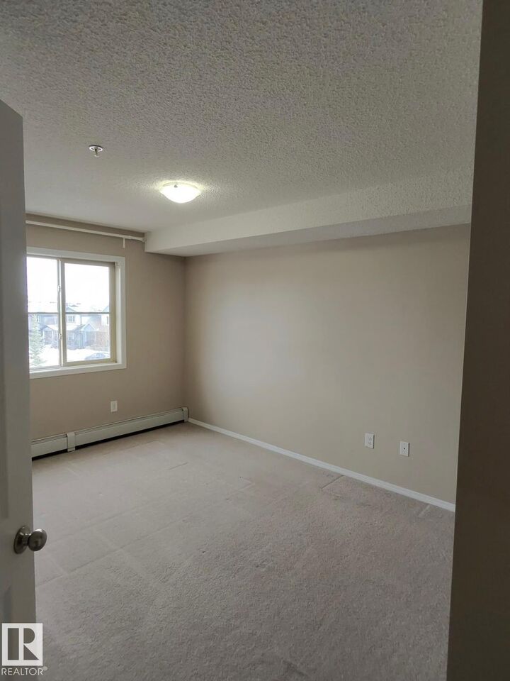 Property Photo: 1060 McConachie Boulevard NW 303 AB T5J 0W9