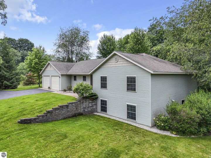 Property Photo:  210 Cinnamon Lane  MI 49696 