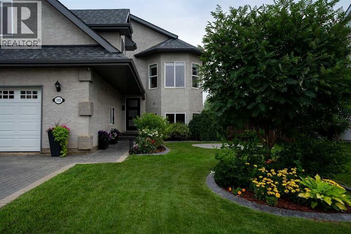 Property Photo:  105 Lindstrom Crescent  AB T9K 2N7 