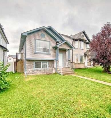 Property Photo: 202 Saddlemead Green NE AB T3J 4M7