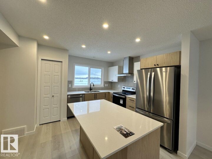 Property Photo:  22803 94 Anenue NW  AB T5T 3Y2 