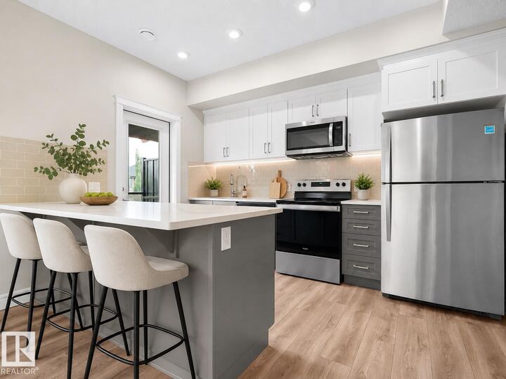 Property Photo:  446 Allard Boulevard SW 3  AB T6W 3S7 