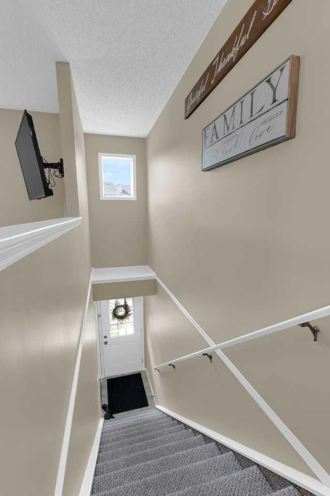 Property Photo: 140 Sagewood Boulevard SW 411 AB T4B 3H5