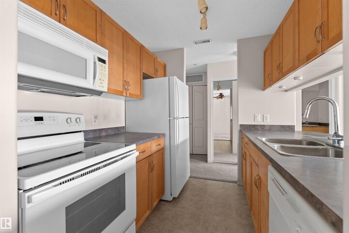 Property Photo:  16303 95 Street NW 224  AB T5Z 3V1 