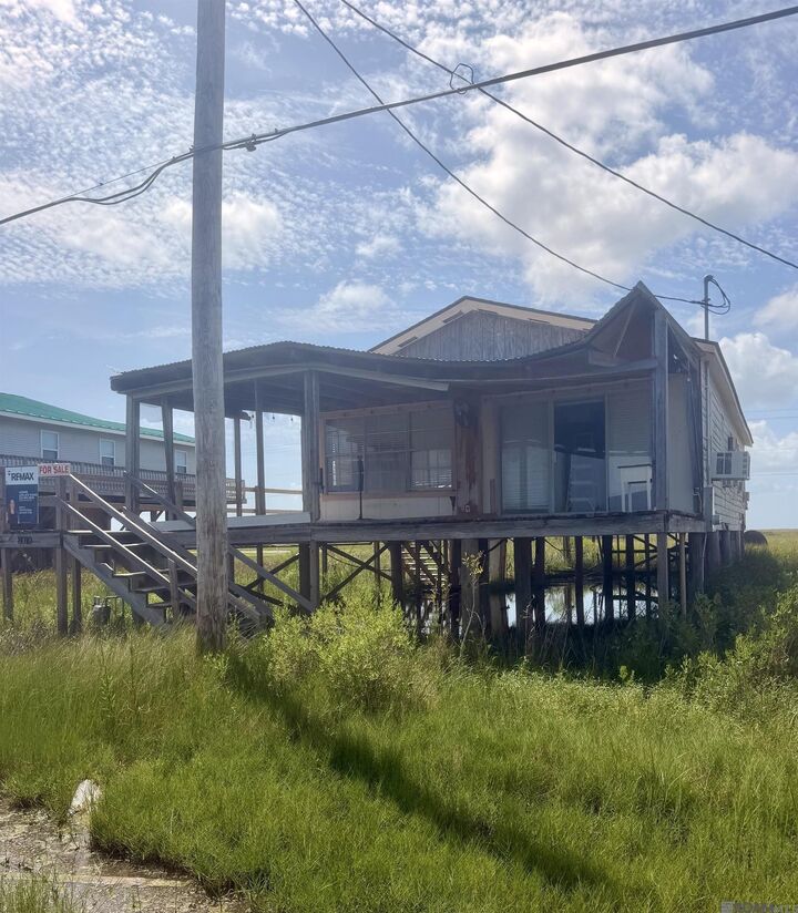Property Photo:  8010 Redfish St  LA 70344 