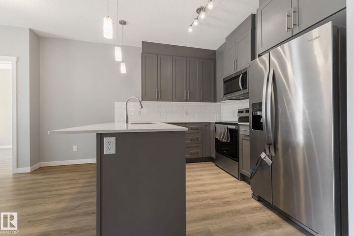 Property Photo:  812 Welsh Drive SW 121  AB T6X 1Y7 