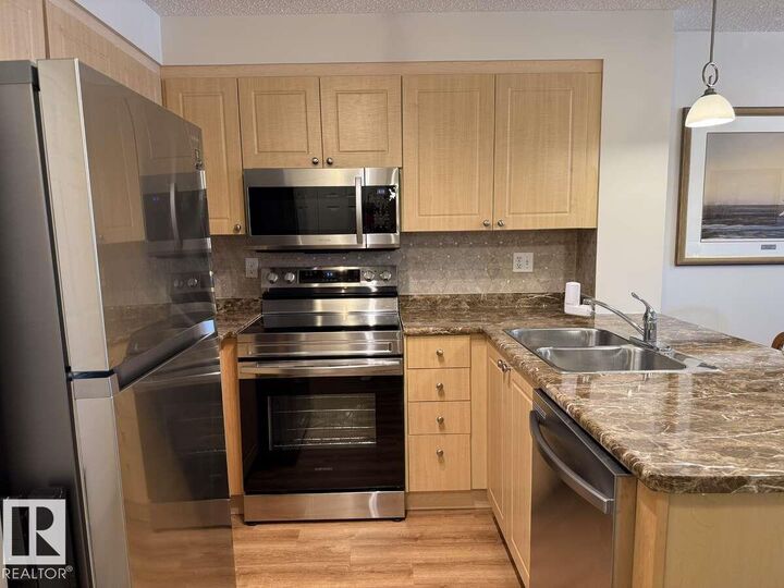 Property Photo: 616 McAllister Loop SW 113 AB T6W 1N1