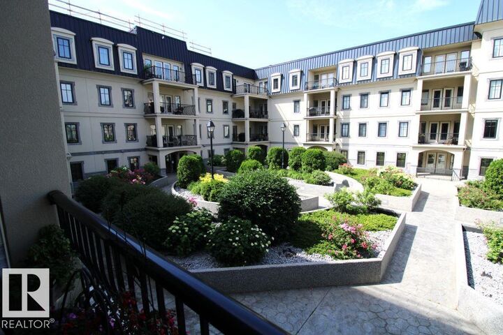 Property Photo: 1406 Hodgson Way NW 201 AB T6R 3K1