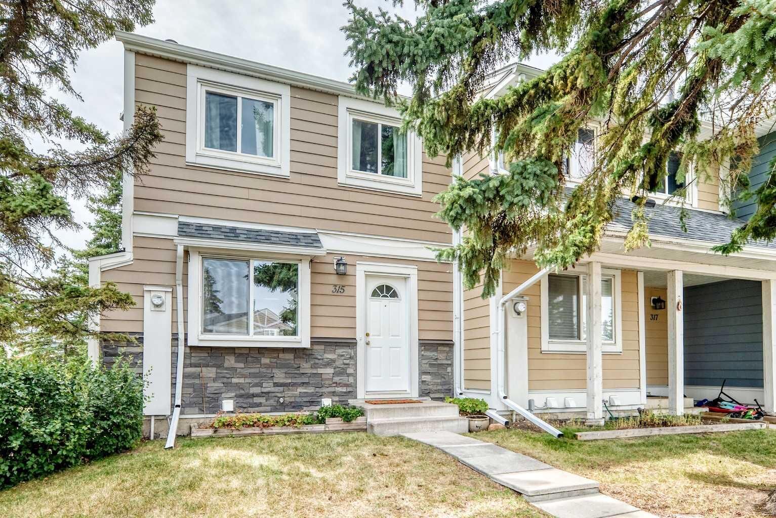 Property Photo:  315 Georgian Villas NE  AB T2A 7E1 