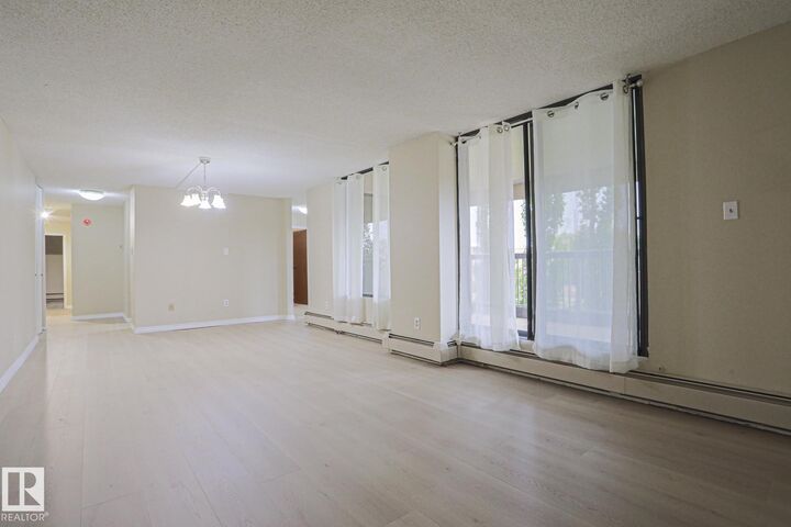Property Photo: 8220 Jasper Avenue NW 102 AB T5H 4B6