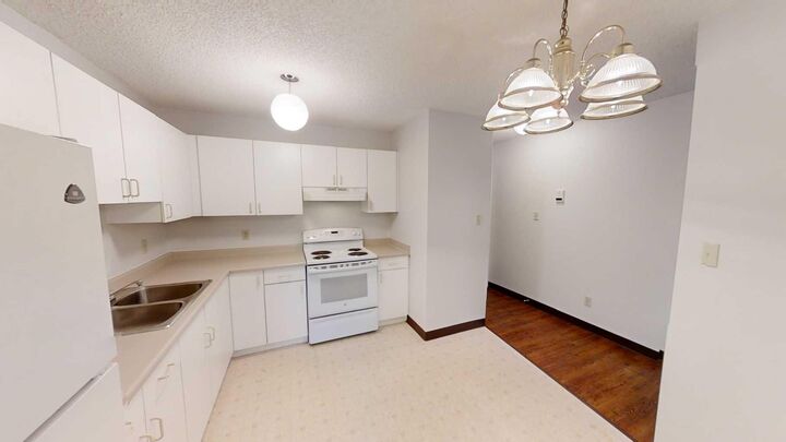 Property Photo:  5117 44 Street 201  AB T0G 1E0 