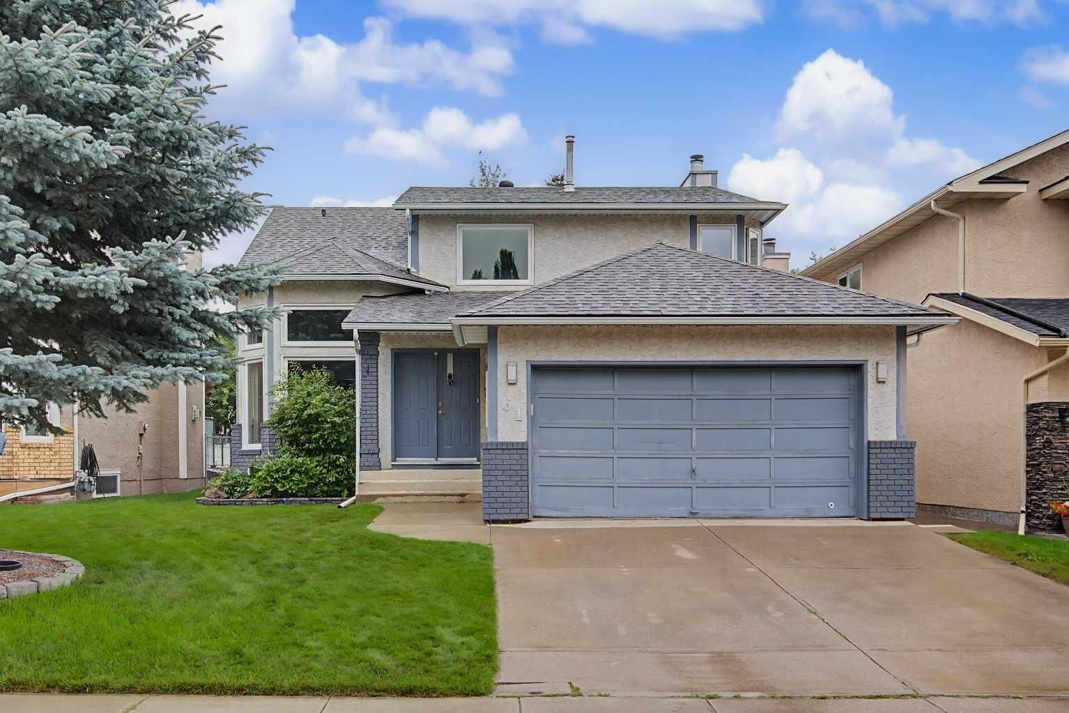 Property Photo: 61 Wood Valley Road SW AB T2W 5Y6