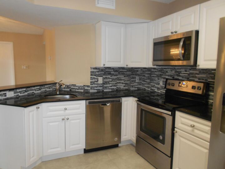 Property Photo:  8977 Wiles Road 203  FL 33067 