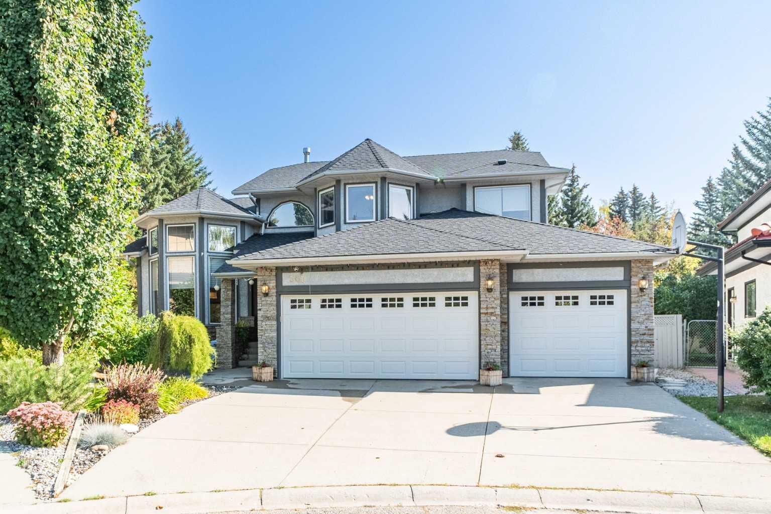 Property Photo: 307 Woodhaven Bay SW AB T2W 5S2