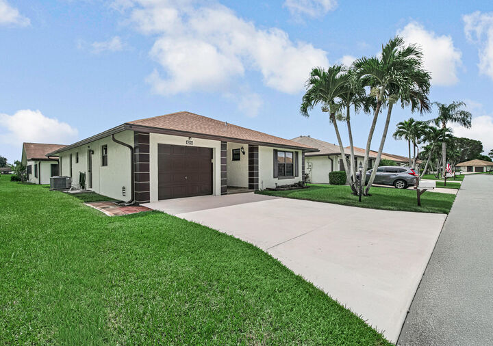 Property Photo:  6210 Olivewood Circle  FL 33463 