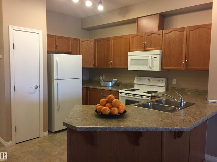 Property Photo:  4316 139 Avenue NW 111  AB T5Y 0L1 