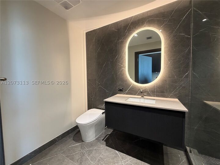 Property Photo:  20 NE 11th 2703B  FL 33132 
