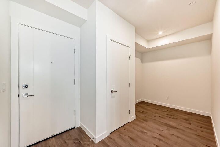 Property Photo: 8370 Broadcast Avenue SW 205 AB T3H 6L3