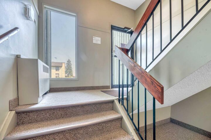 Property Photo: 10120 Brookpark Boulevard SW 111 AB T2W 3G3