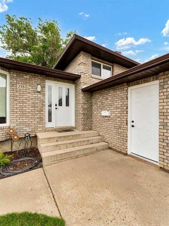 Property Photo:  238 Cameron Road SE  AB T1B 1P3 