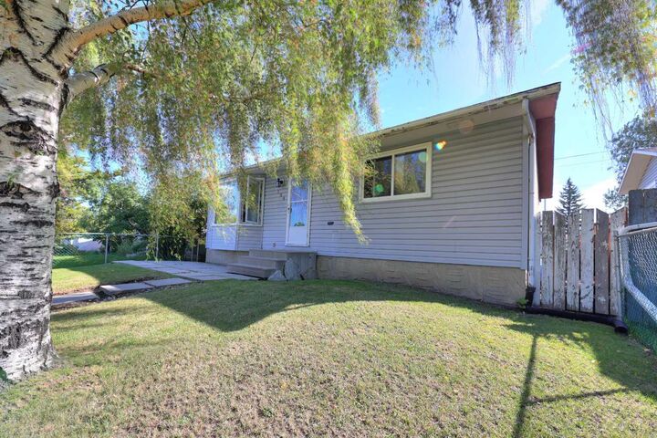Property Photo: 108 Pinecliff Way NE AB T1Y 3X3