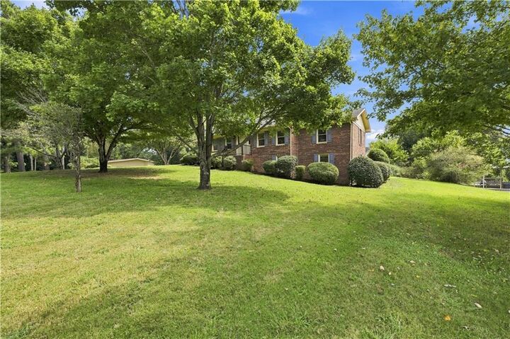 Property Photo:  208 Woodland Circle SE  GA 30701 