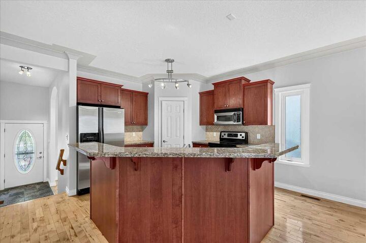 Property Photo: 125 25 Avenue NW AB T2M 2A4