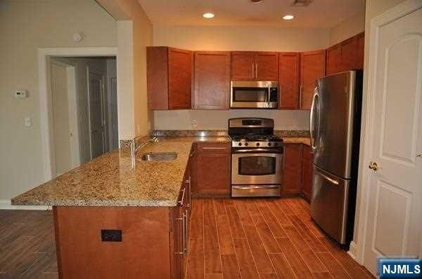 Property Photo:  1303 Windsor Park 303  NJ 07631 