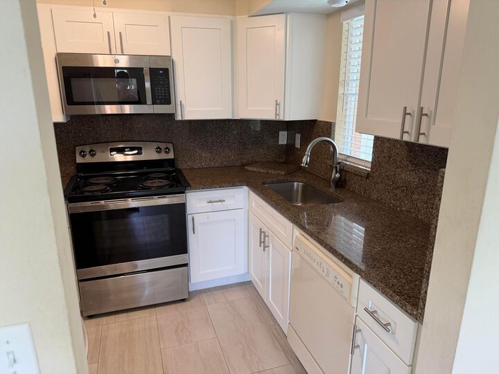 Property Photo:  1512 SE Royal Green Circle 203  FL 34952 