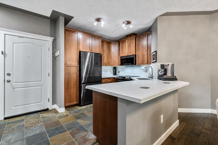 Property Photo:  20 Discovery Ridge Close SW 233  AB T3H 5X4 
