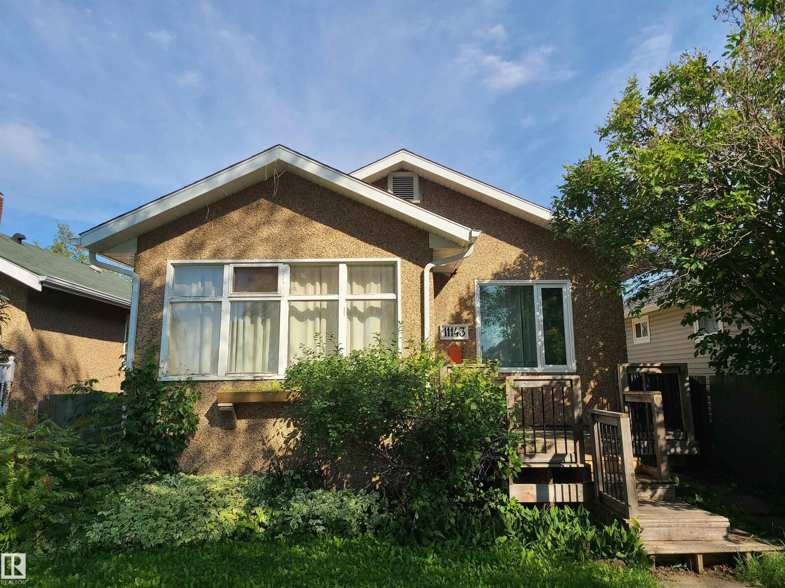 Property Photo:  11143 127 Street NW  AB T5M 0T5 