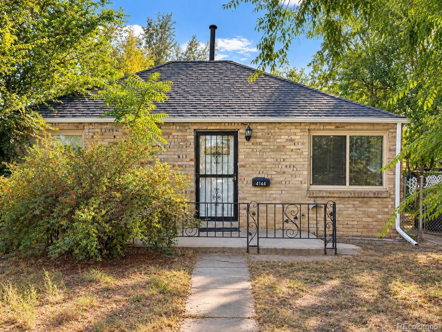 Property Photo:  4144 Saint Paul Street  CO 80216 