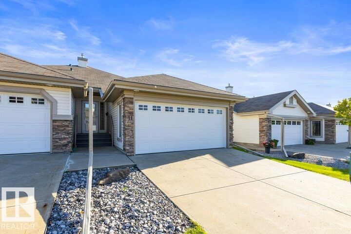Property Photo: 4 Heritage Way 11 AB T8N 6W3