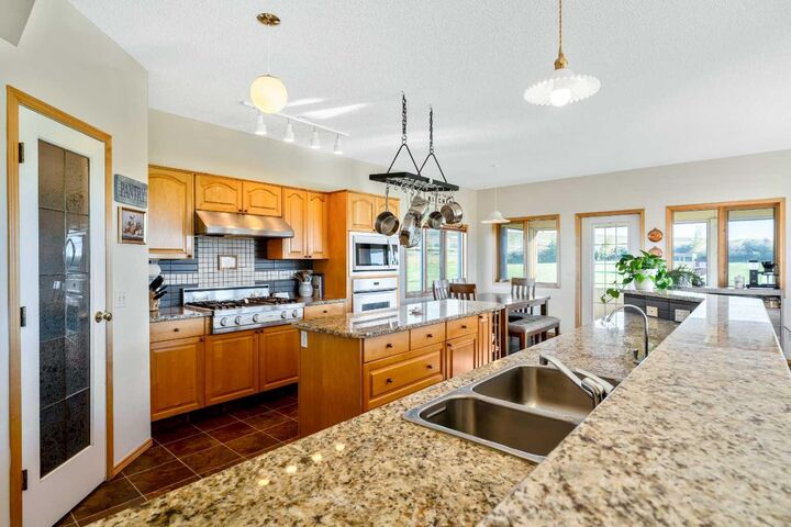 Property Photo:  386109 128 Street W  AB T1S 6E1 
