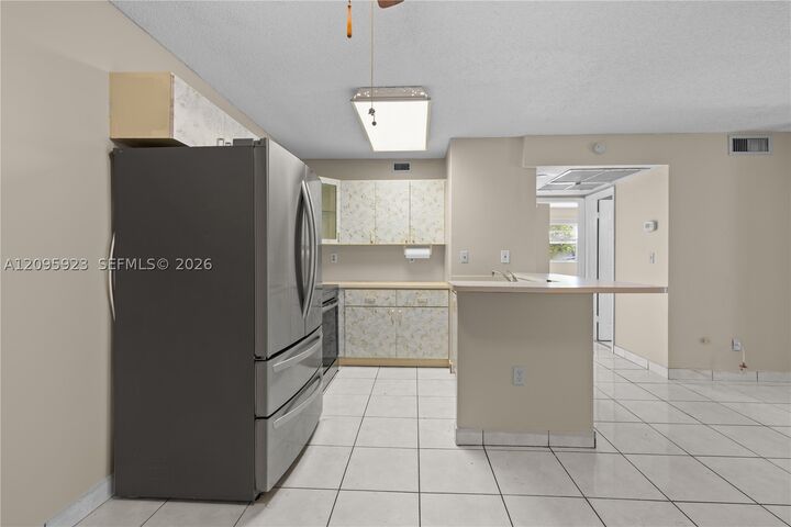 Property Photo:  15619 SW 73rd Cir Ter 10-9  FL 33193 