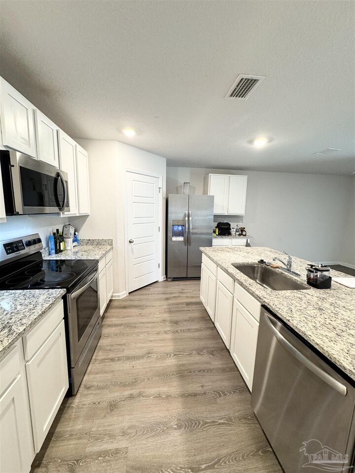 Property Photo:  6311 Burrow Ln  FL 32526 