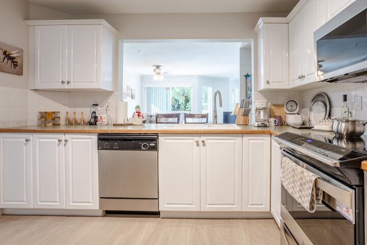 Property Photo:  6557 121 Street 205  BC V3W 1E7 