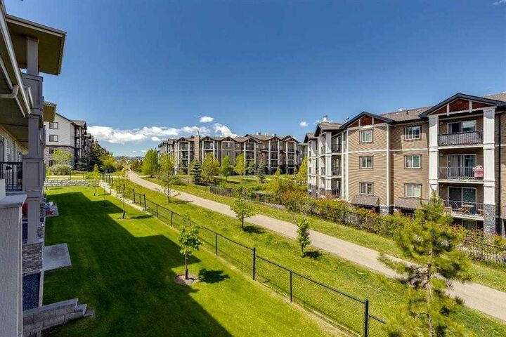 Property Photo:  22 Panatella Road NW 207  AB T3K 0V4 
