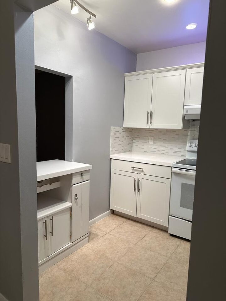 Property Photo:  83 Easthampton D  FL 33417 