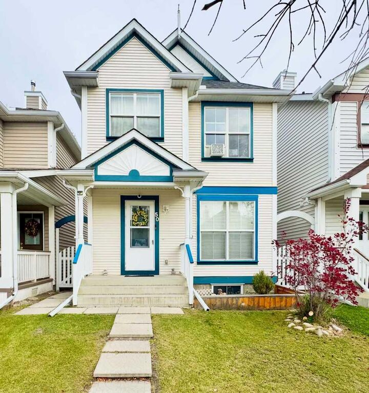 Property Photo:  50 Prestwick Way  AB T2Z 3L9 