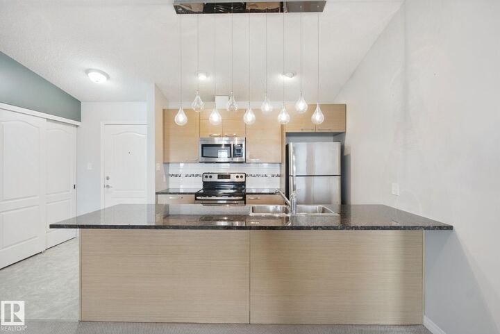 Property Photo:  9351 Simpson Drive NW 3415  AB T6R 0N4 