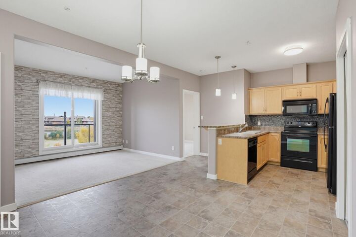 Property Photo:  304 Ambleside Link SW 310  AB T6W 0V2 