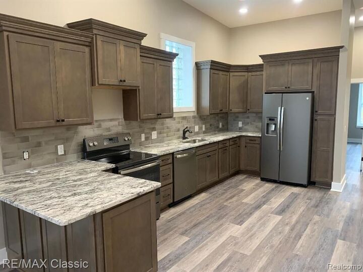 Property Photo:  109 - 2 W Grand River Avenue  MI 48843 