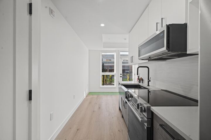 Property Photo:  10405 147 Street 105  BC V3R 0J5 