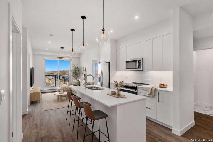Property Photo:  265 Wolf Willow Boulevard SE 1522  AB T2X 3Z8 