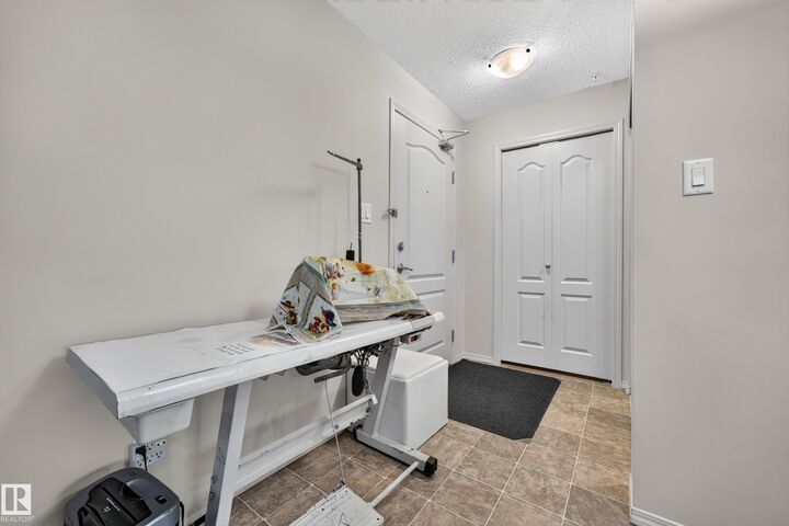 Property Photo: 5951 165 Avenue NW 206 AB T5Y 0J6