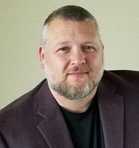 John Grissam,  in Colorado Springs, Kenney & Company